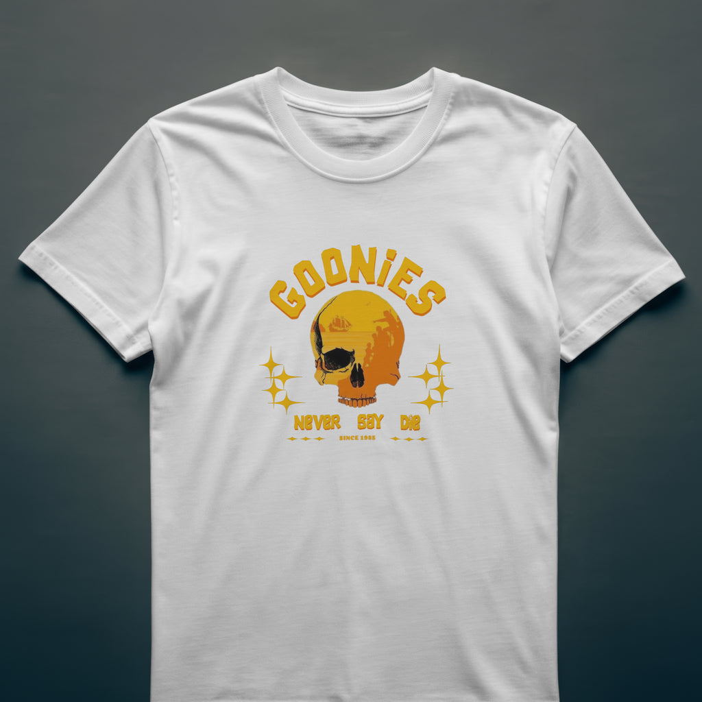 White t-shirt with yellow 'Goonies' graphic on a dark gray background