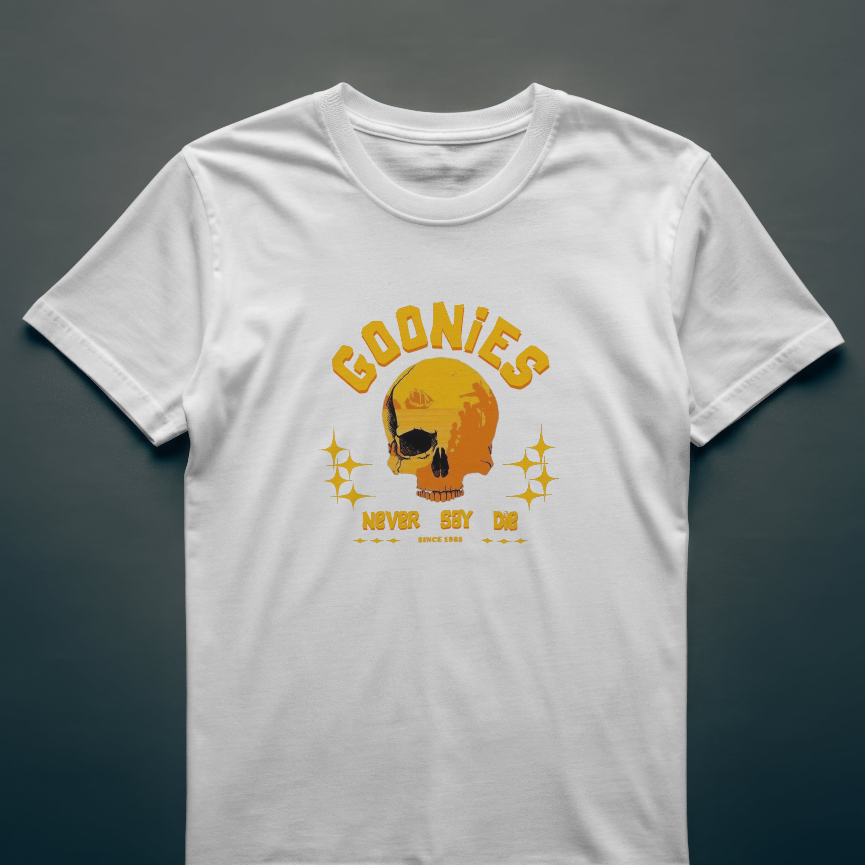 White t-shirt with yellow 'Goonies' graphic on a dark gray background